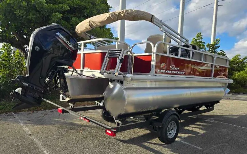Slide: The Image of 2025 Sun Tracker Party Barge 18 DLX pontoon boat with Mercury outboard engine. - 10