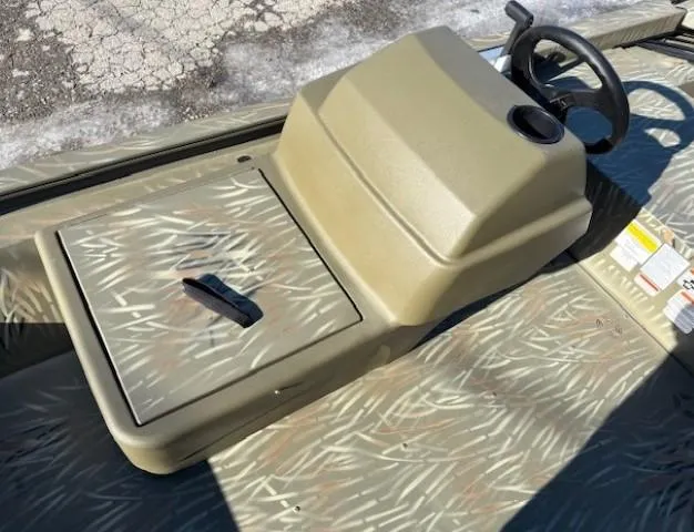 Slide: The Image of 2024 Tracker Grizzly 1648 SC boat console with camouflage pattern. - 6