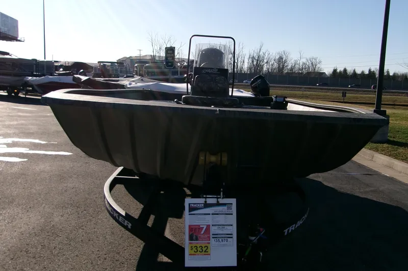 Slide: The Image of 2025 Tracker Grizzly 2072 CC boat displayed outdoors on a trailer. - 3