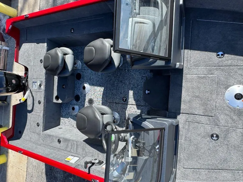 Slide: The Image of 2025 Tracker Pro Guide V-175 WT boat interior with seating and steering console. - 5