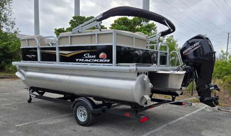 Slide: The Image of 2025 Sun Tracker Party Barge 16 DLX pontoon boat with Mercury outboard motor. - 10