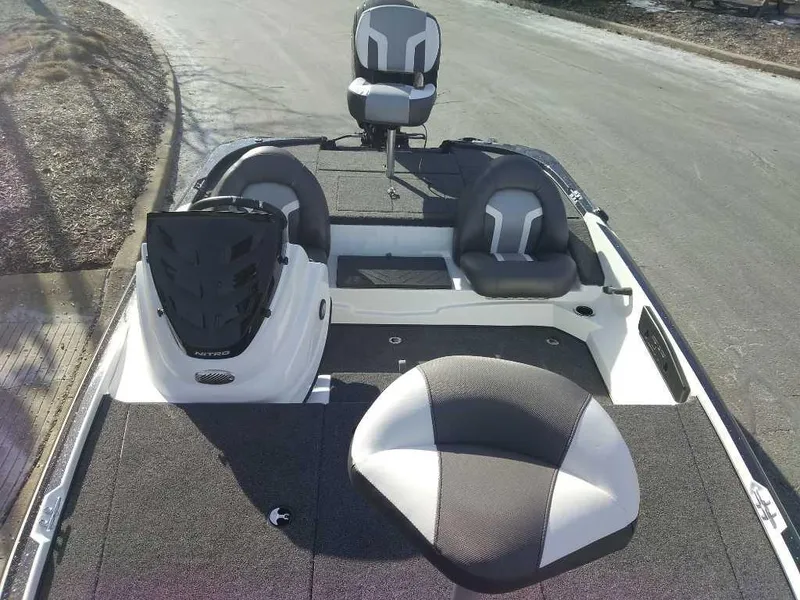 Slide: The Image of 2025 Nitro Z17 boat interior with seating and steering console. - 2