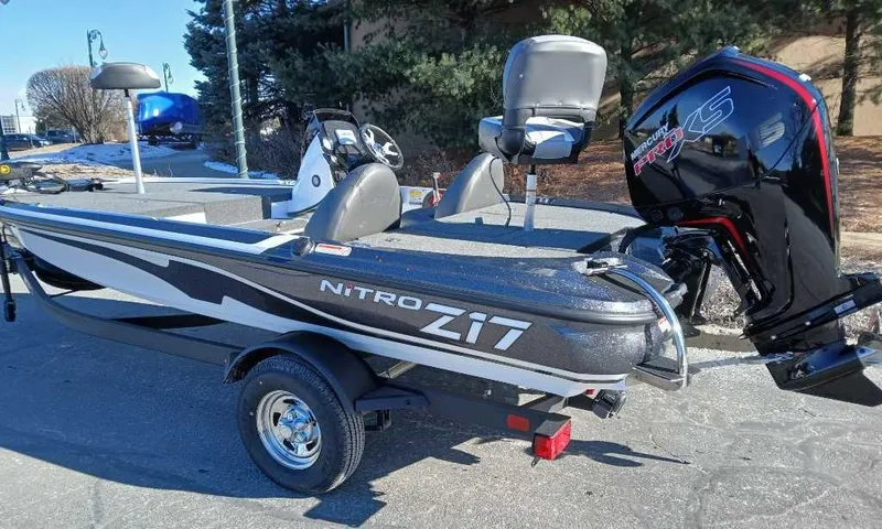 Slide: The Image of 2025 Nitro Z17 boat with powerful outboard motor, parked outdoors on a sunny day. - 4