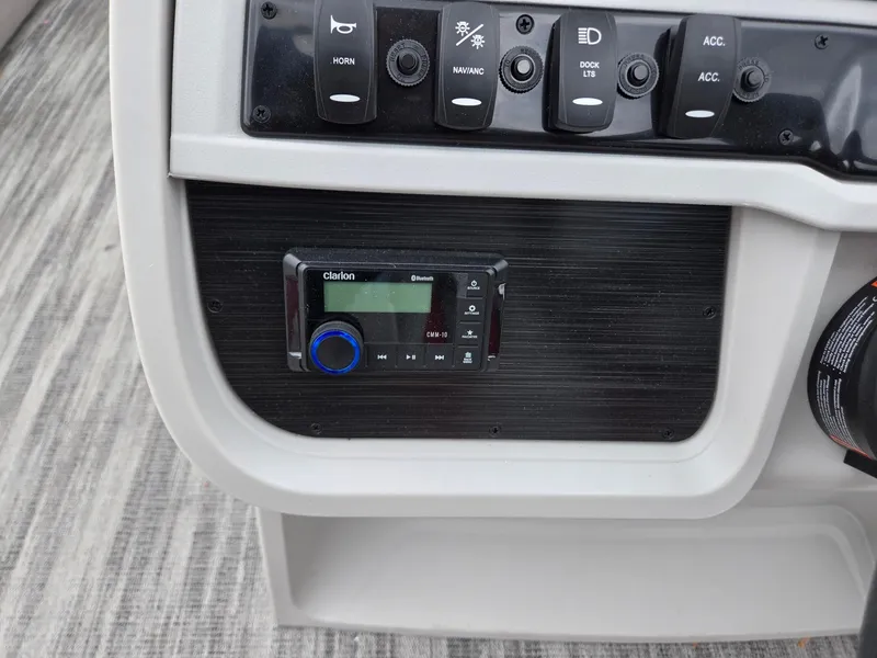 Slide: The Image of Control panel of 2025 Godfrey SWEETWATER 2286 SFL boat with Clarion audio system. - 14