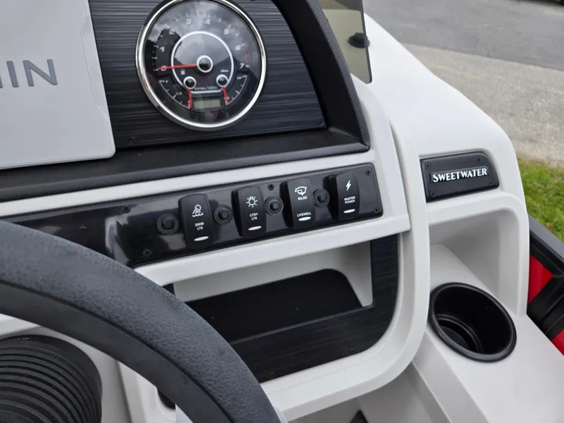 Slide: The Image of Dashboard of 2025 Godfrey SWEETWATER 2286 SFL boat with control panel and speedometer. - 15