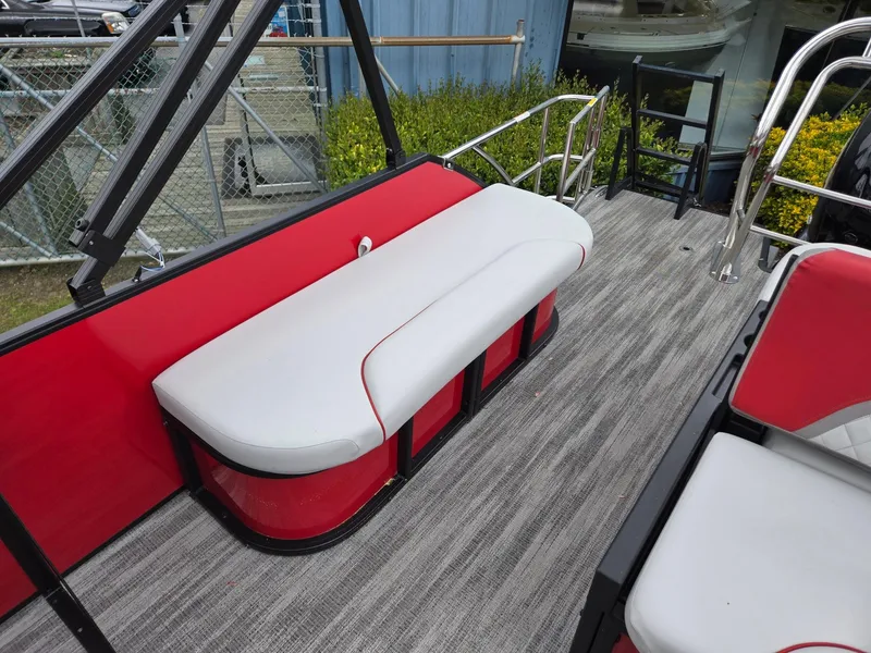 Slide: The Image of 2025 Godfrey SWEETWATER 2286 SFL boat interior with red and white seating. - 18