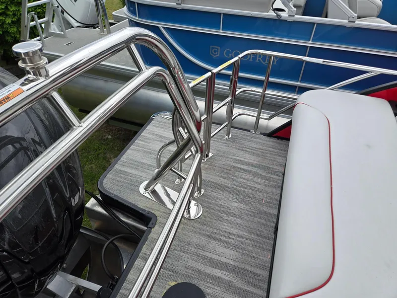 Slide: The Image of 2025 Godfrey SWEETWATER 2286 SFL boat deck with stainless steel railings and seating. - 22