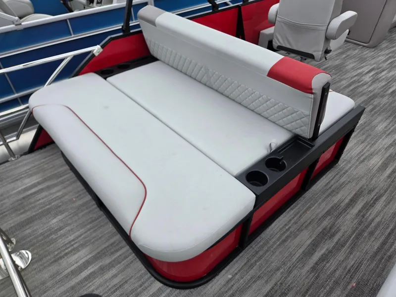 Slide: The Image of 2025 Godfrey SWEETWATER 2286 SFL boat seating with red accents and cup holders. - 23