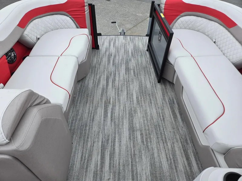 Slide: The Image of 2025 Godfrey SWEETWATER 2286 SFL interior with red and white seating, gray flooring. - 30