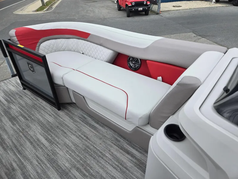Slide: The Image of 2025 Godfrey SWEETWATER 2286 SFL boat interior with red and gray seating. - 31