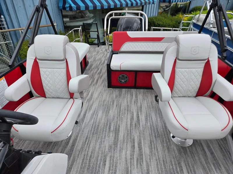 Slide: The Image of 2025 Godfrey SWEETWATER 2286 SFL boat interior with red and white seating. - 9