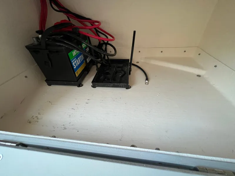 Slide: The Image of Battery compartment of 2025 Defiance Admiral 220 EX boat with wiring. - 24
