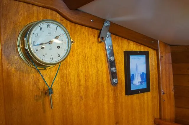 Slide: The Image of Vintage Ericson 39 Flush Deck interior with clock and sailboat picture, 1971. - 18