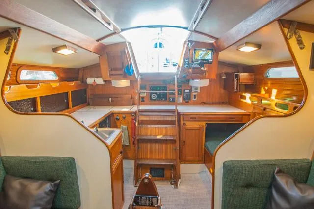 Slide: The Image of Interior of 1971 Ericson 39 Flush Deck sailboat with wooden cabinetry and cozy seating. - 22