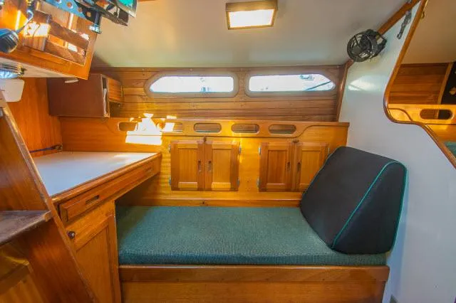 Slide: The Image of Interior of 1971 Ericson 39 Flush Deck sailboat with wooden cabinetry and seating area. - 35