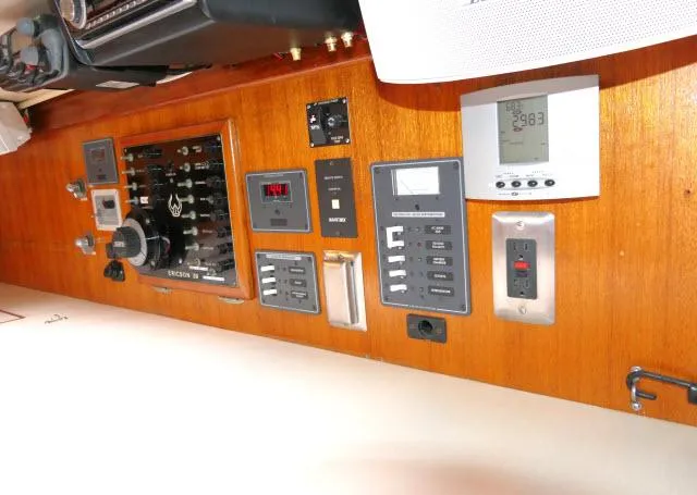 Slide: The Image of Control panel of a 1971 Ericson 39 Flush Deck sailboat with various switches and gauges. - 36