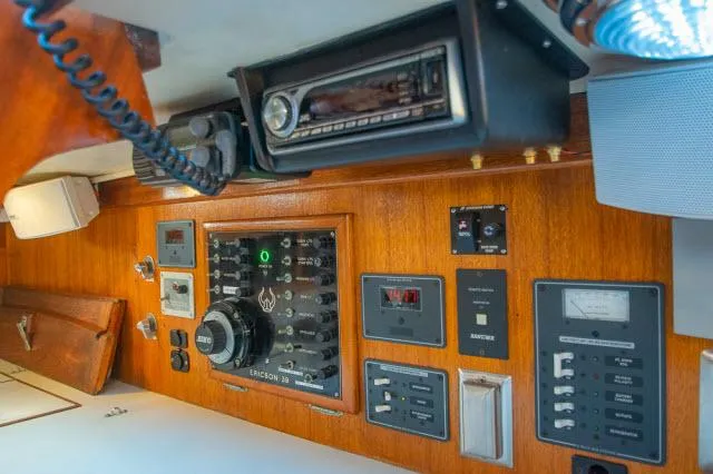 Slide: The Image of Control panel of a 1971 Ericson 39 Flush Deck sailboat with radio and switches. - 37