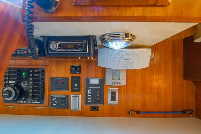 Slide: The Image of Control panel of a 1971 Ericson 39 Flush Deck sailboat with audio equipment. - 38