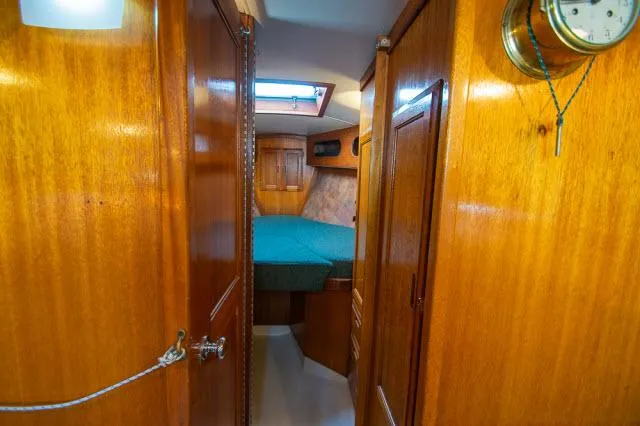Slide: The Image of Interior of 1971 Ericson 39 Flush Deck sailboat with wooden paneling and cozy cabin. - 43