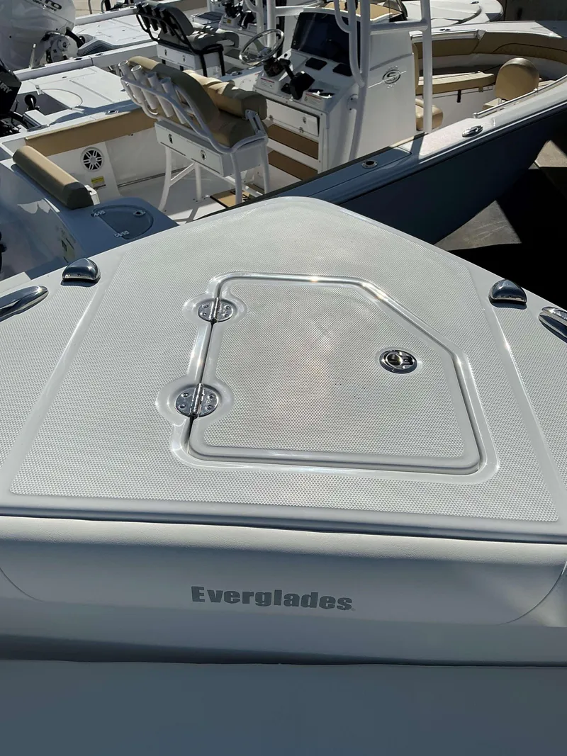 Slide: The Image of 2025 Everglades 273 CC boat deck with seating and control panel. - 11