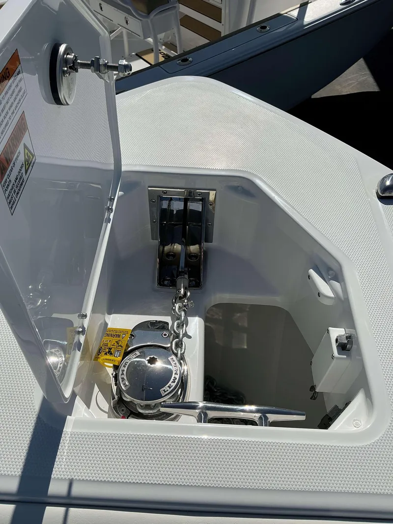 Slide: The Image of Anchor locker of 2025 Everglades 273 CC boat with chain and winch. - 12