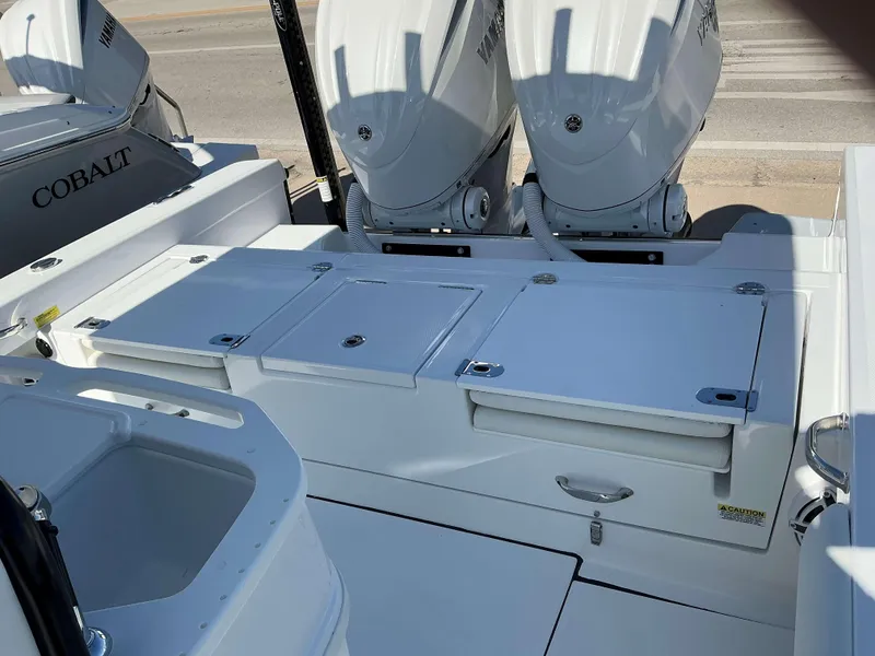 Slide: The Image of 2025 Everglades 273 CC boat with dual Yamaha outboard engines, featuring a spacious deck layout. - 13