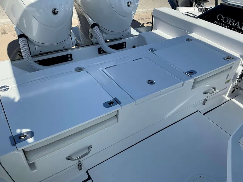 Slide: The Image of 2025 Everglades 273 CC boat with dual engines and storage compartments. - 15