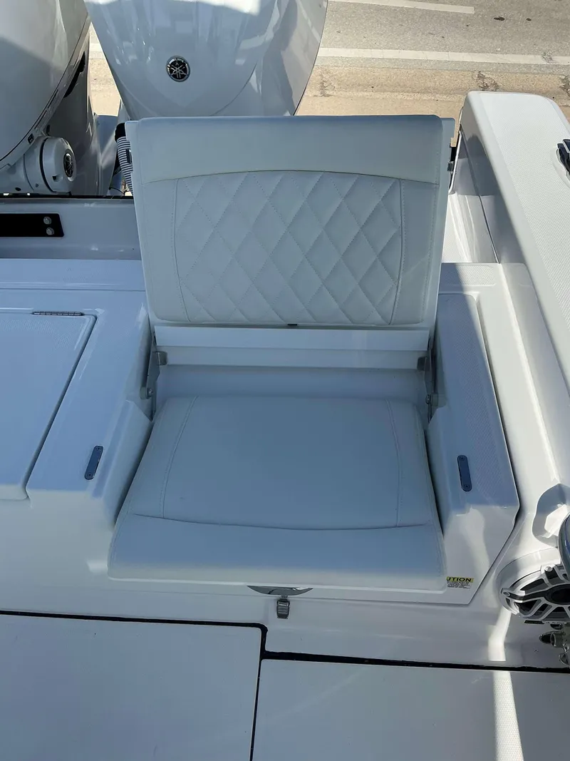 Slide: The Image of 2025 Everglades 273 CC boat seat with diamond stitching, white upholstery. - 16