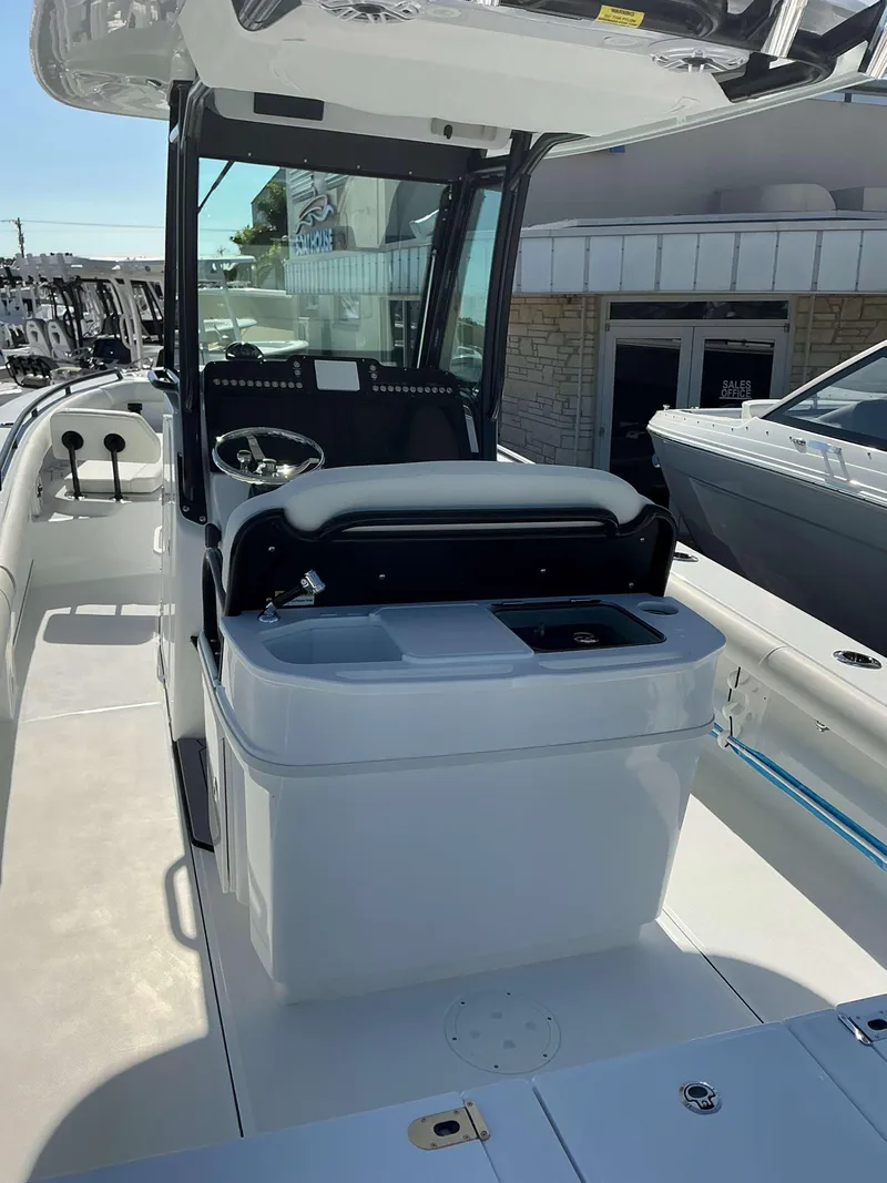 Slide: The Image of 2025 Everglades 273 CC boat interior with helm and seating area. - 20