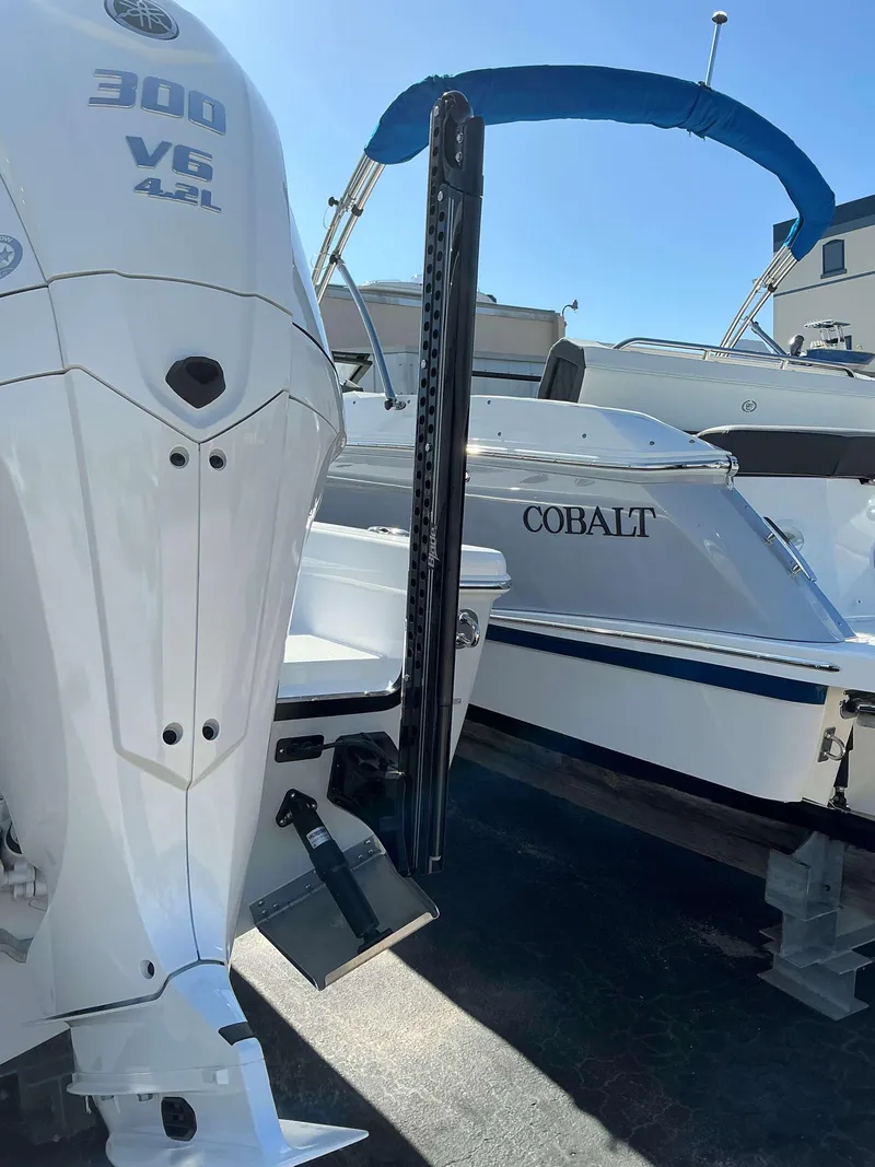 Slide: The Image of 2025 Everglades 273 CC boat with Yamaha 300 V6 engine, docked beside Cobalt boat. - 22