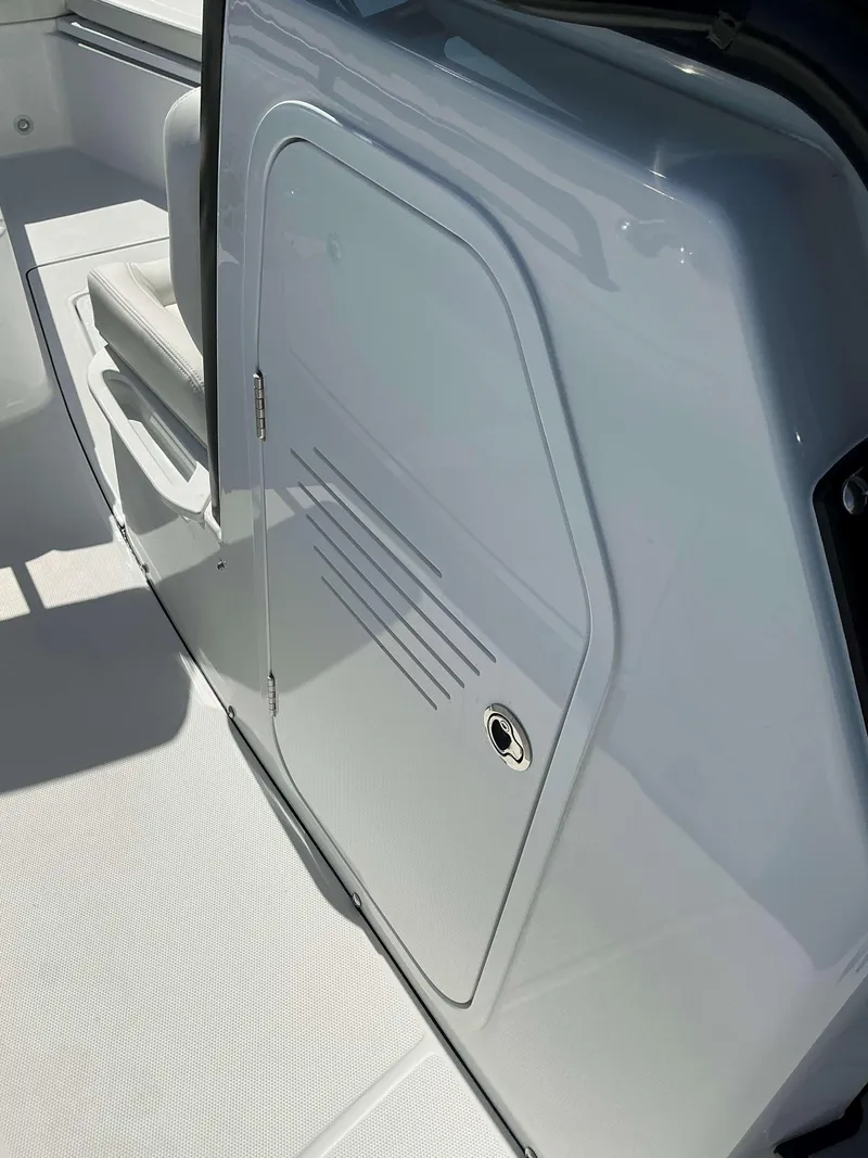 Slide: The Image of Everglades 273 CC 2025 boat interior with sleek storage compartment. - 24