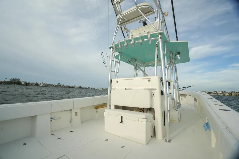 Slide: The Image of 2013 SeaVee 390B boat with tower, on open water, clear sky. - 28