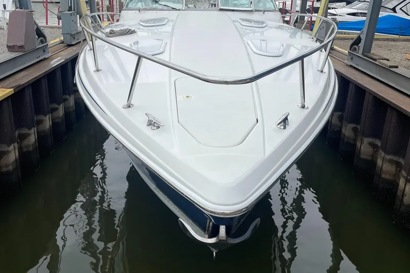 Slide: The Image of 2002 Formula 400 Super Sport boat docked in marina. - 12