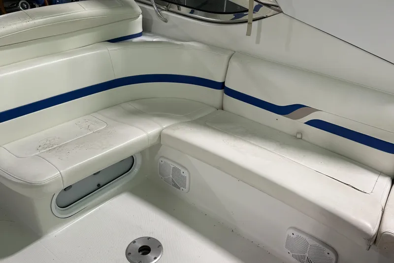 Slide: The Image of 2002 Formula 400 Super Sport boat interior with white and blue seating. - 13