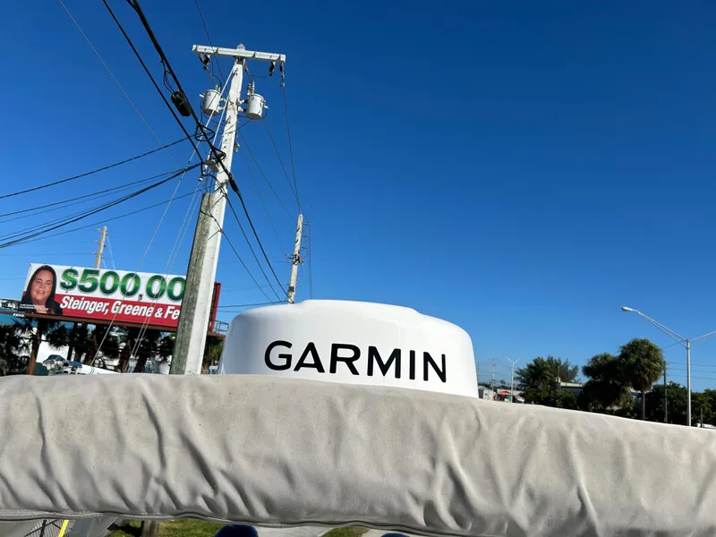 Slide: The Image of Garmin radar on 2022 World Cat 255DC boat, clear blue sky background. - 18