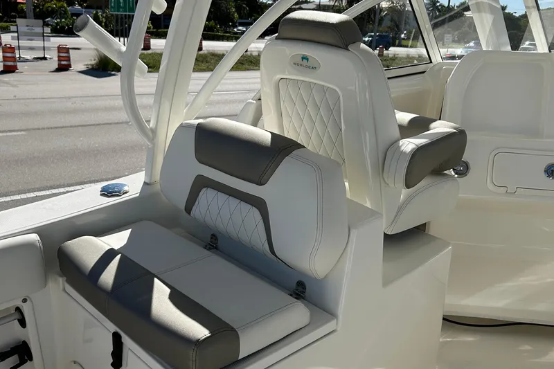 Slide: The Image of 2022 World Cat 255DC boat interior with cushioned seating and modern design. - 19
