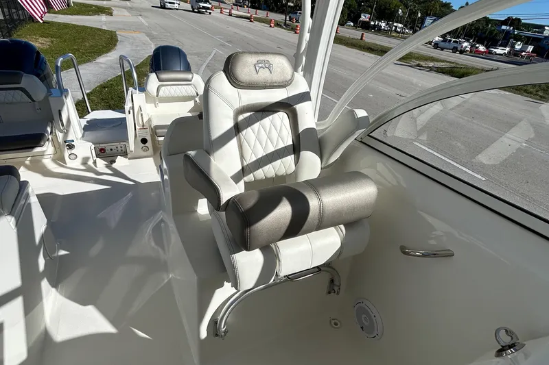 Slide: The Image of 2022 World Cat 255DC boat interior with luxurious seating and modern design. - 23