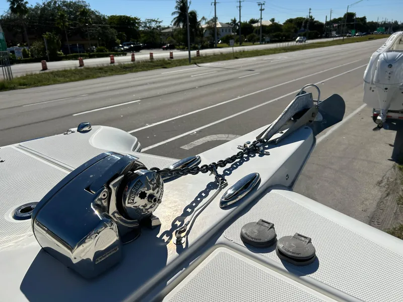 Slide: The Image of 2022 World Cat 255DC boat anchor and chain on deck, roadside view. - 27