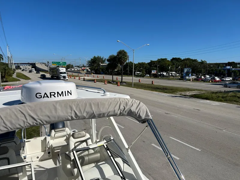 Slide: The Image of World Cat 255DC boat with Garmin equipment on a highway, 2022 model. - 28