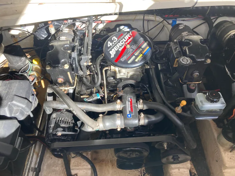 Slide: The Image of Engine compartment of a 2000 Larson Cabrio 290 with a 4.3L MerCruiser engine. - 17