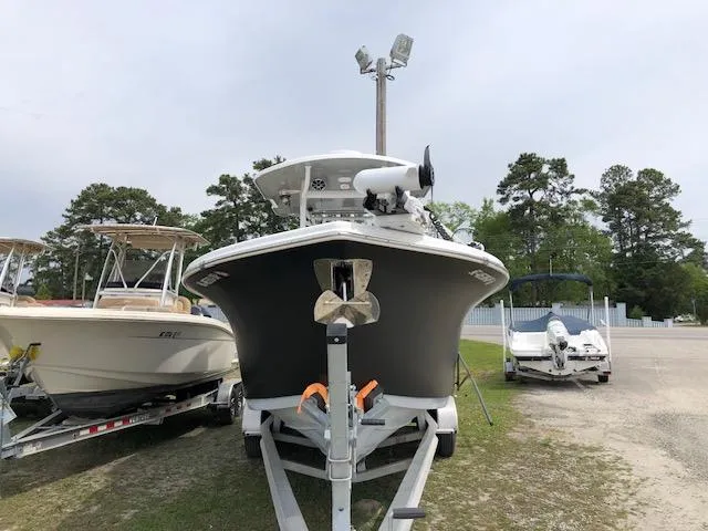 Slide: The Image of 2021 Sea Pro 259 DLX boat on trailer, parked outdoors. - 2