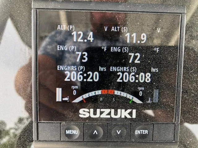 Slide: The Image of Suzuki engine display showing performance metrics on a 2021 Sea Pro 259 DLX boat. - 20