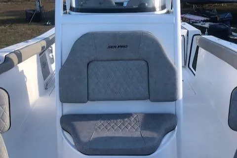 Slide: The Image of 2021 Sea Pro 259 DLX boat interior with gray cushioned seating. - 9