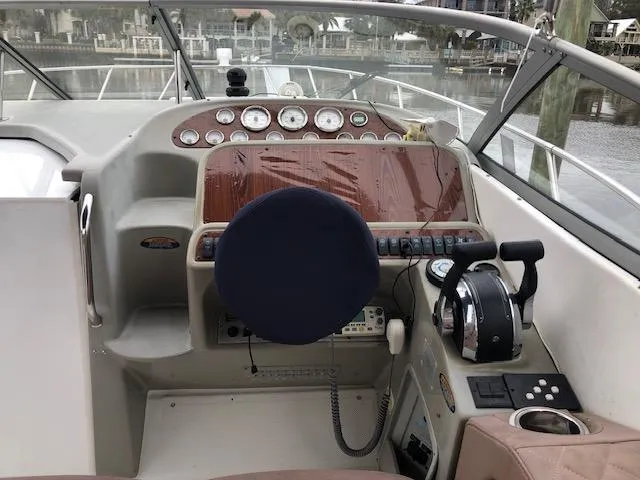 Slide: The Image of 2000 Bayliner 3055 Ciera boat helm with gauges and controls. - 15