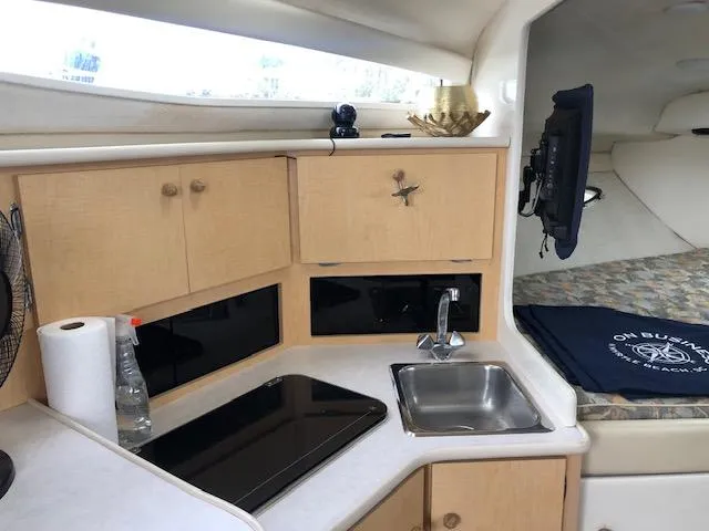 Slide: The Image of Interior of 2000 Bayliner 3055 Ciera boat with kitchenette and sink. - 19