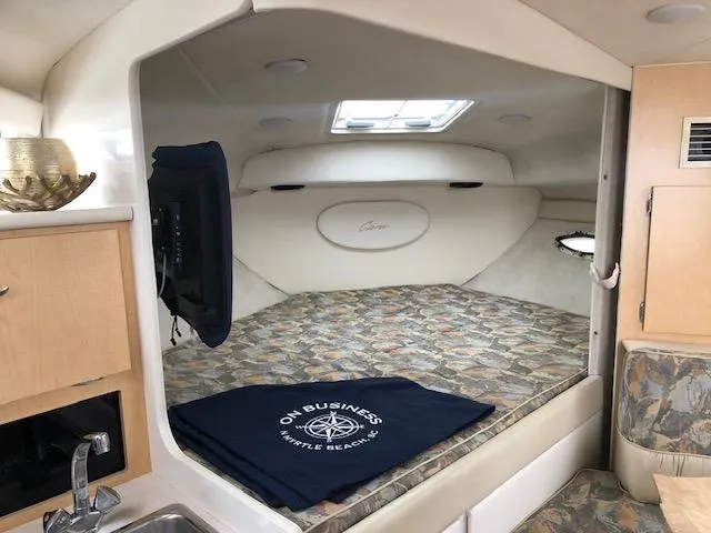 Slide: The Image of Interior of 2000 Bayliner 3055 Ciera boat with cozy sleeping area and modern amenities. - 20