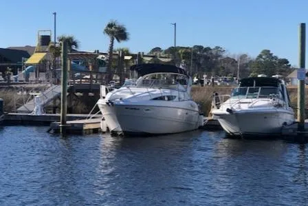 Slide: The Image of 2000 Bayliner 3055 Ciera docked at marina, sunny day, calm waters. - 31
