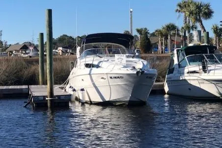 Slide: The Image of 2000 Bayliner 3055 Ciera docked at marina with clear blue sky. - 33