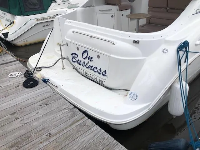 Slide: The Image of Bayliner 3055 Ciera boat docked at Sunset Beach, NC, named "On Business." - 8