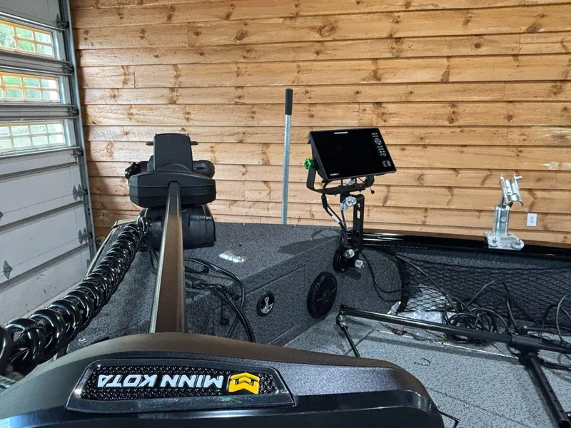 Slide: The Image of 2025 Lund 2025 Impact XS Sport boat interior with Minn Kota trolling motor. - 9